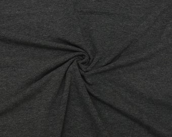 May include: A close-up of a dark gray fabric with a textured, slightly rough surface. The fabric is folded and draped, creating a soft, flowing effect.