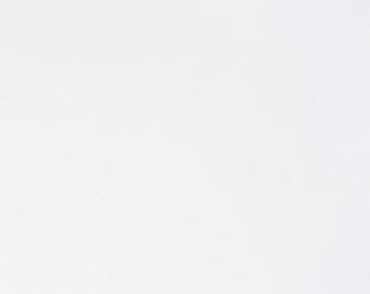 White Heavyweight Cotton Spandex knit. Pricing by the 1/2 yard