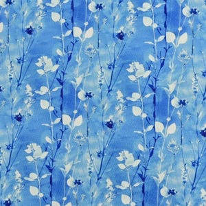 May include: A blue and white floral pattern featuring stylized botanical elements. The design includes vertical stripes with white flowers and leaves, and dark blue accents against a light blue watercolor background. The overall effect is a delicate, nature-inspired print.