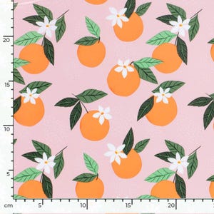 May include: A pink fabric with a repeating pattern of orange fruit and white flowers. The fruit and flowers are stylized and have a flat, graphic look.