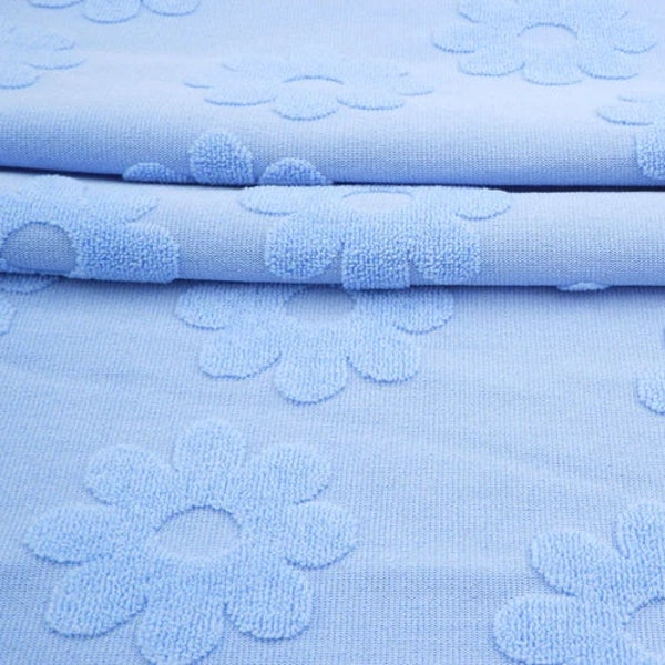 Light Blue Jacquard Daisy Terry Knit. Sold by the 1/2 Yard