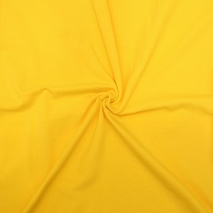 KNIT Fabric: Solid Yellow Cotton Spandex knit. Sold in 1/2 Yard Increments