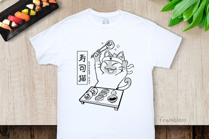 May include: White t-shirt with a black and white illustration of a cat wearing a headband and holding chopsticks with a sushi roll. The text "Sushi Cat" and Japanese characters are printed on the shirt.