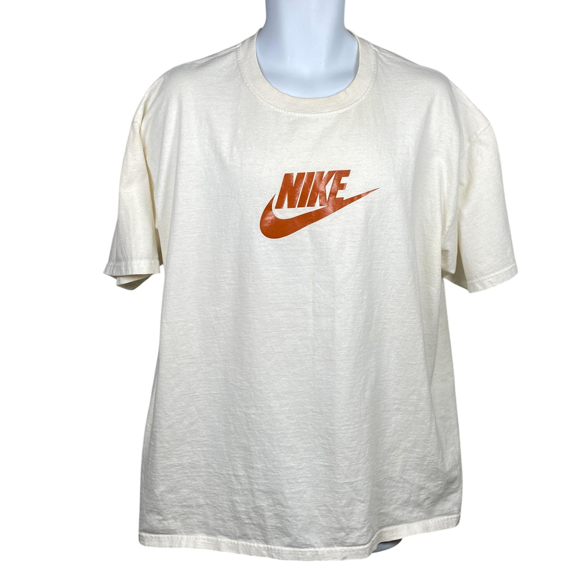 nike tee with swoosh in the middle