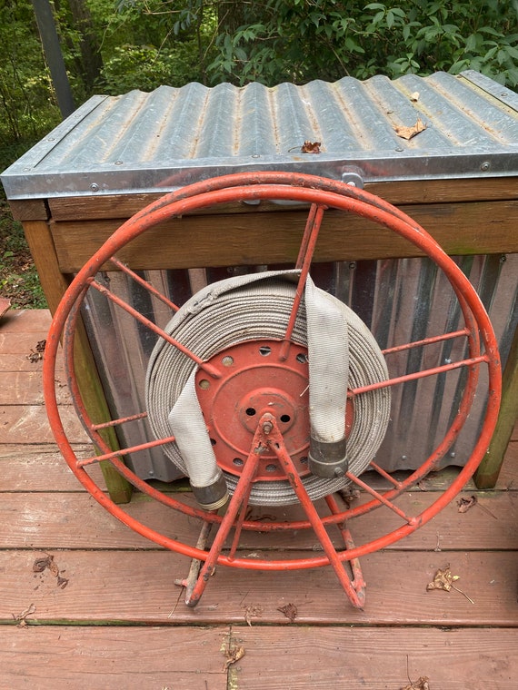 Vintage Firehose and Wall-Mounted Metal Reel