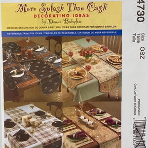 May include: A McCall's pattern for reversible tabletop items. The cover shows four table settings with placemats, runners, and napkins. The text "More Splash Than Cash" and "Decorating Ideas" are visible.