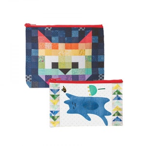 May include: Two zippered pouches with a patchwork design. The top pouch features a colorful cat face with a rainbow pattern. The bottom pouch features a blue cat with a white background and a bee and umbrella design.