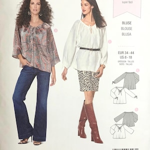 May include: A Burda Style sewing pattern, number 6227, featuring blouse designs. The cover shows two women modeling blouses, one with a paisley print and the other in white. Includes size information and the words "super easy".