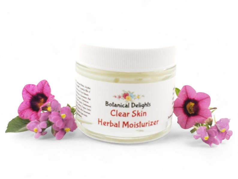 a jar of clear skin with flowers around it