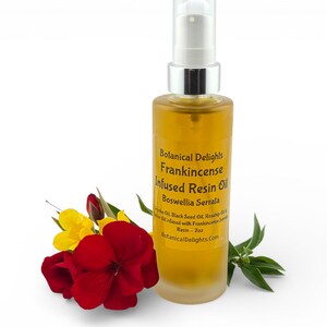 a bottle of Frankincense Resin Oil surrounded by a red flower and green leaves.