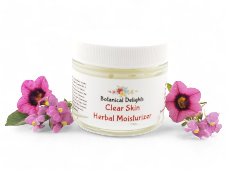 a jar of clear skin with flowers around it