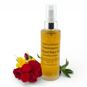a bottle of Frankincense infused resin oil surrounded by red and yellow flowers, with a white background.