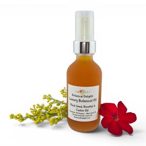 May include: A bottle of Botanical Delights Luxury Botanical Oil with a white label, a yellow flower, and a red flower. The label lists the ingredients as Black Seed, Rosehip & Castor Oil.