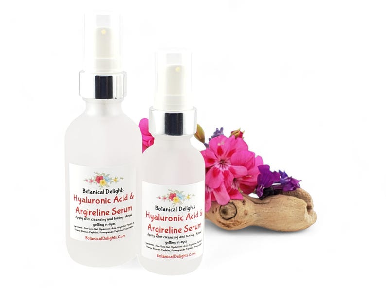 a couple of bottles of liquid next to a flower