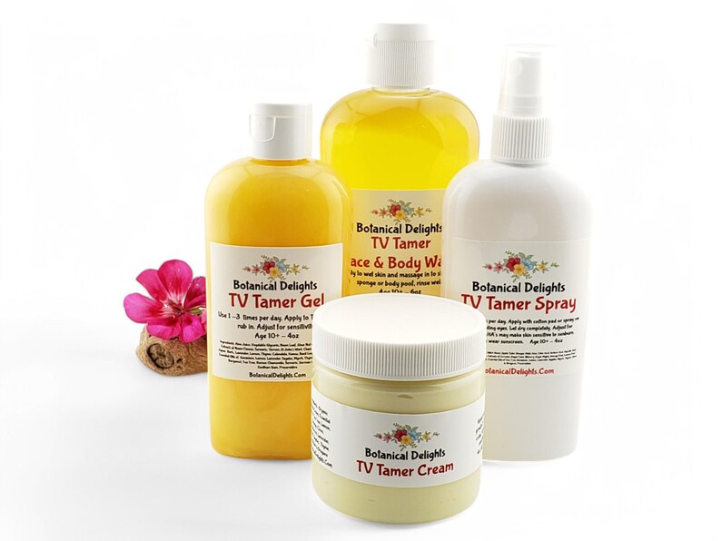 May include: Four bottles of yellow and white liquid with labels that read "Botanical Delights TV Tamer Gel", "Botanical Delights TV Tamer Face & Body Wash", "Botanical Delights TV Tamer Spray", and "Botanical Delights TV Tamer Cream".