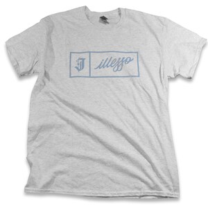 May include: A gray t-shirt with a blue rectangular box containing the text "illego" and a stylized letter "J".