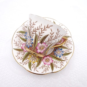 1940s Rosina Teacup and Saucer Pink Blue and Yellow Flowers with Green and Brown Foliage Made in England