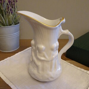 French Porcelain Creamer or Bud Vase White Cherub Relief with Gold Trim