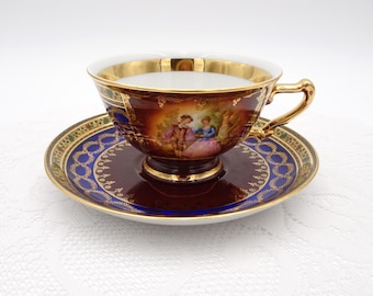 JKW Josef Kuba Fragonard Tea Cup and Saucer: Love Story, Gold Filigree, Carlsbad
