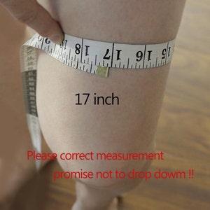 May include: A white measuring tape wrapped around a person's leg, showing a measurement of 17 inches. The text "Please correct measurement promise not to drop down!!" is written in red below the measurement.