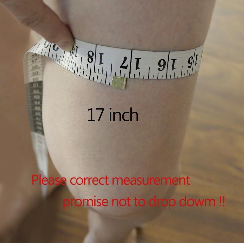 May include: A white measuring tape wrapped around a person's leg, showing a measurement of 17 inches. The text "Please correct measurement promise not to drop down!!" is written in red below the measurement.