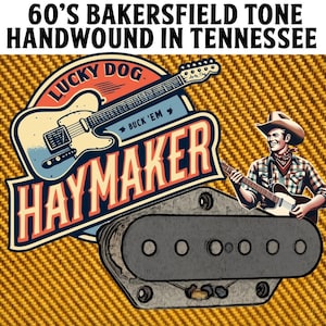May include: A close-up of a guitar pickup with a black and white design. The pickup is labeled "Haymaker" and "Lucky Dog" with the text "Buck 'Em".