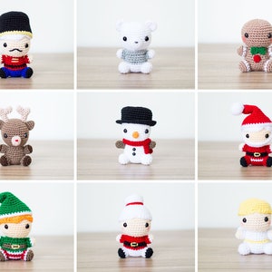 May include: Nine crocheted Christmas ornaments, including a gingerbread person, a snowman, a reindeer, a nutcracker, a polar bear, Santa Claus, an elf, and two angels. The ornaments are all white, brown, red, green, and black.