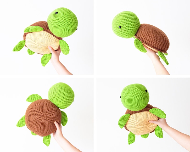 May include: A crocheted turtle toy with a green head and brown shell. The turtle is being held by a hand.