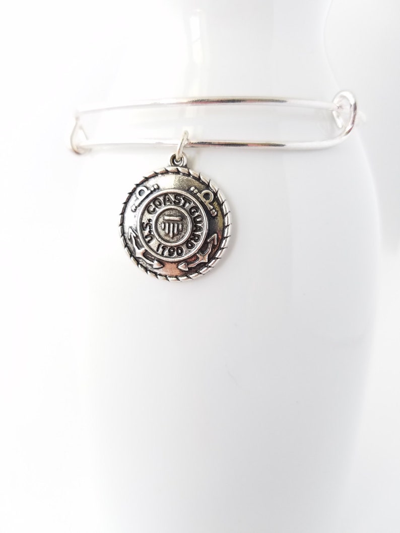 Armed Forces United States Coast Guard emblem on a silver plated bangle bracelet