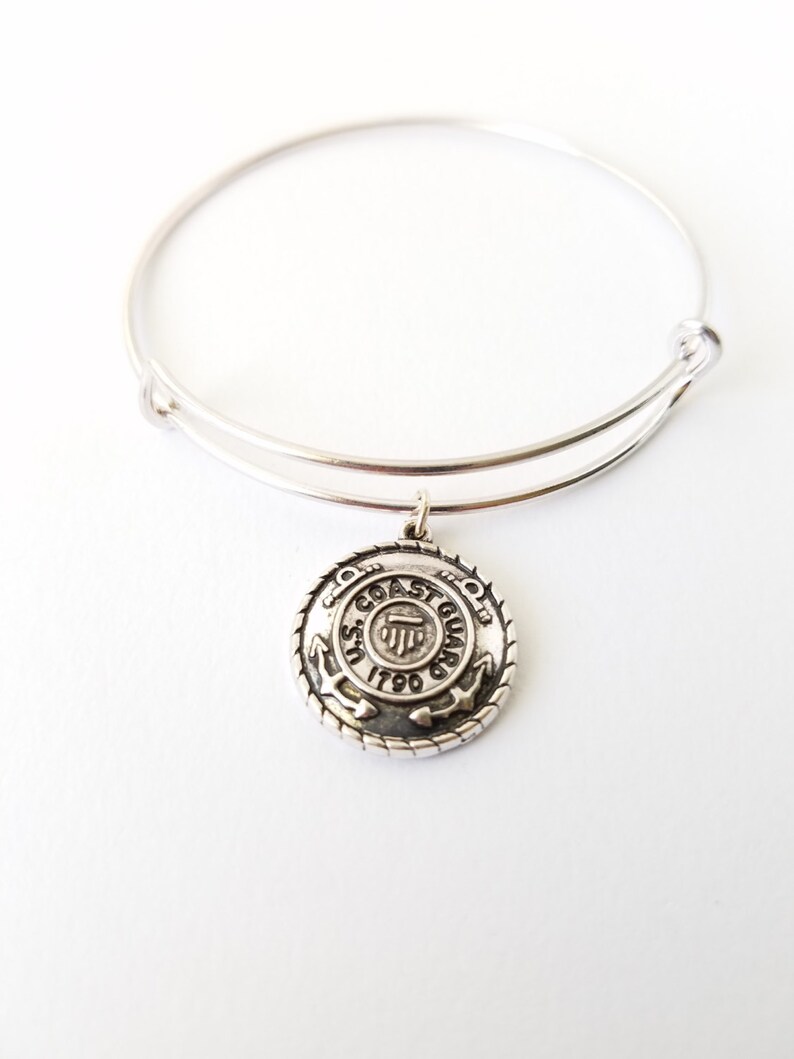 Armed Forces United States Coast Guard emblem on a silver plated bangle bracelet