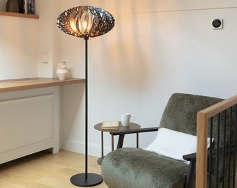 Sculpted Serenity: Wooden Floor Lamp with Handcrafted Metallic Base Featuring Unique Patterns