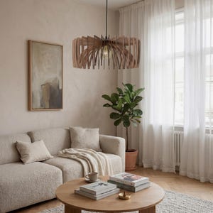 May include: A circular pendant light fitting constructed from thin, vertical wooden slats arranged in a radial pattern. The light features a central exposed bulb suspended by a black cord, creating a structured, layered appearance with natural wood tones.