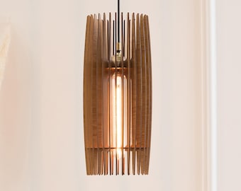 May include: A cylindrical pendant light fixture constructed from vertical brown wooden slats arranged in a cage-like pattern. The fixture features a central tubular Edison-style light bulb emitting a warm glow, suspended by a black cord.