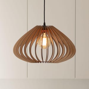 May include: A pendant light fixture featuring a series of curved, light-colored wooden slats arranged in a circular, cage-like structure. A single round, glowing Edison-style light bulb is suspended in the center by a thin black cord.