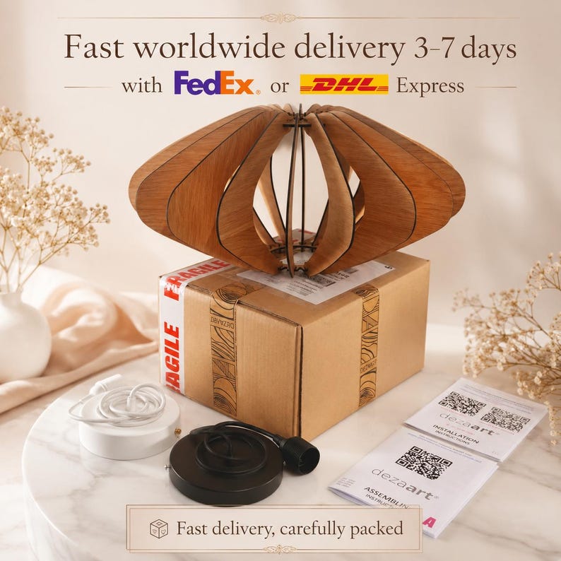 May include: A wooden pendant light fixture with curved slats, a brown cardboard shipping box, a white ceiling canopy, a black ceiling canopy, and two instruction cards with QR codes labeled dezaart. The light is unassembled.