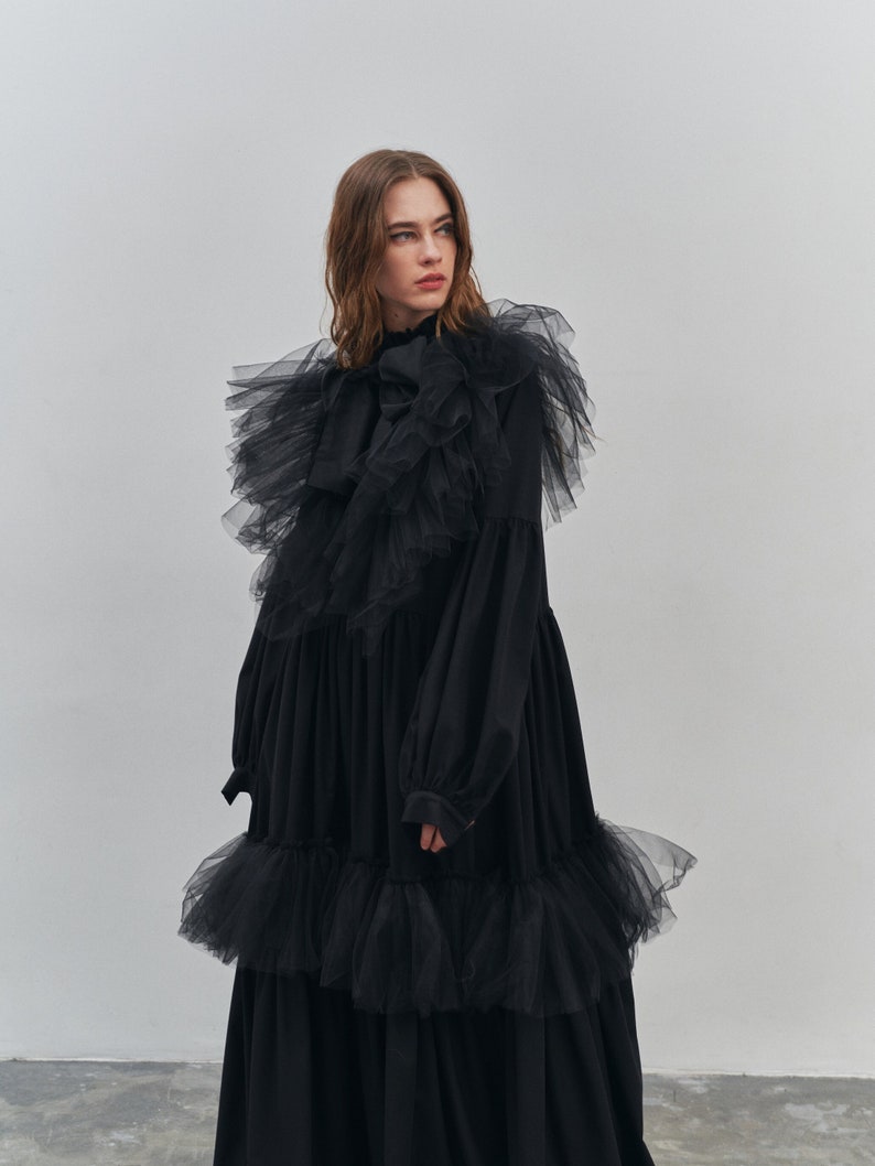 Black maxi dress with frills and smocking. Black designer gown.