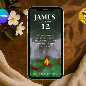 May include: A smartphone displays a birthday invitation with the text "JAMES IS TURNING 12". The invitation includes event details: date, time, and RSVP information. A campfire scene is depicted on the invitation. The phone rests on a wooden surface.