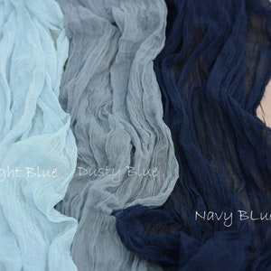 May include: Three swatches of fabric in different shades of blue. The swatches are labeled "Light Blue", "Dusty Blue", and "Navy Blue".