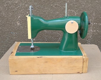Vintage toy sewing machine for kids, soviet sewing toy for a collection