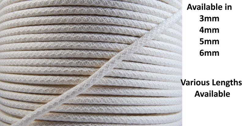 May include: Close-up of a spool of white cotton cord. Available in 3mm, 4mm, 5mm, and 6mm. Various lengths available.