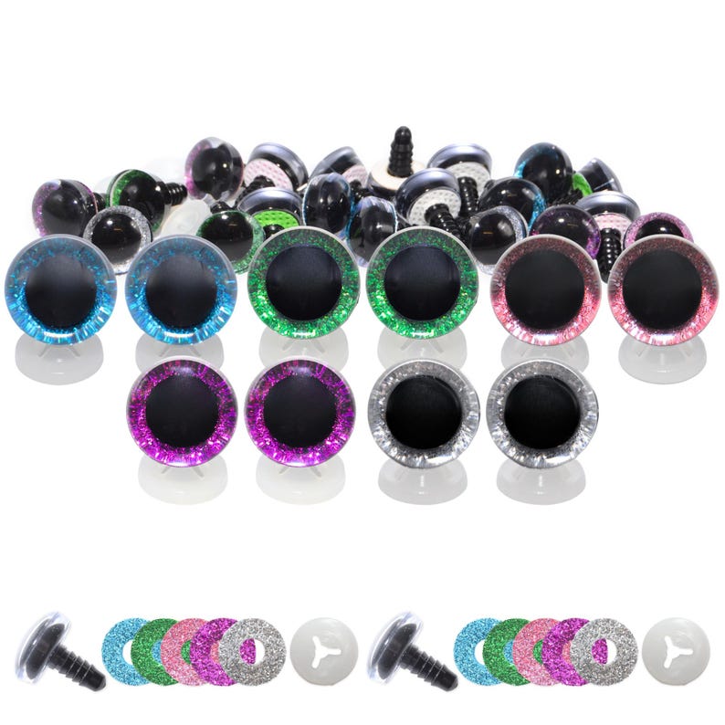May include: A collection of colorful craft eyes in various sizes. The eyes have black pupils and glittery rims in blue, green, pink, purple, and silver. Some eyes have black stems for attachment, and there are also clear plastic washers.