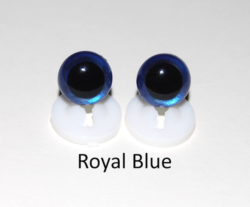 May include: Two royal blue plastic safety eyes with black pupils, mounted on white plastic bases.  Royal Blue.