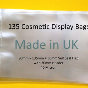 May include: A stack of 135 clear plastic self-seal bags with a header. The bags are 90mm x 135mm + 30mm self-seal flap with a 30mm header and are 40 micron thick. The text "Made in UK" is printed on the bags.