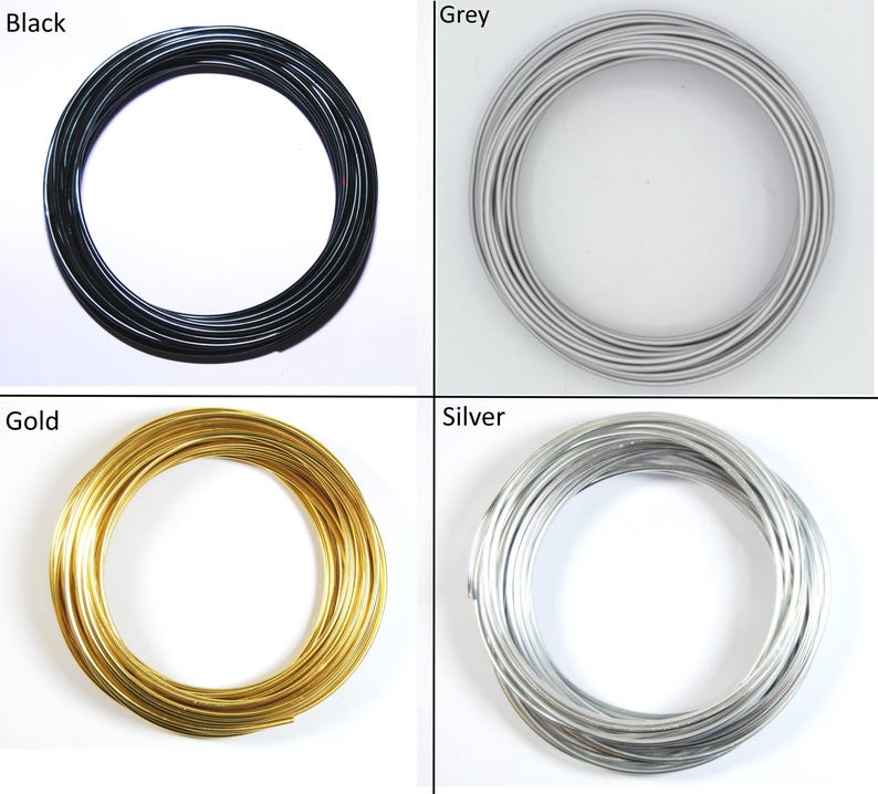 May include: Four spools of wire in different colors: black, gray, gold, and silver. The wire is coiled into a circle.