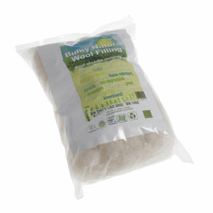 May include: A clear plastic bag containing 100g of bulky natural wool filling. The label features the text Bulky Natural Wool Filling, mentions flame retardant, bio-degradable, and renewable properties, and lists standards BS EN71, BS 5852, and BS 1425.