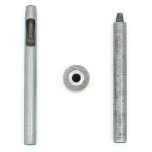 May include: Three metal tools for leatherworking or crafts are displayed against a white background. The tools include a hollow punch, a solid punch, and a small metal disc. The tools are made of silver-coloured metal.
