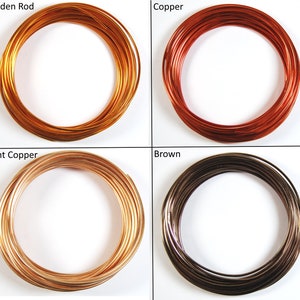 May include: Four spools of wire in different colors: golden rod, copper, light copper, and brown. The wire is coiled in a circle.