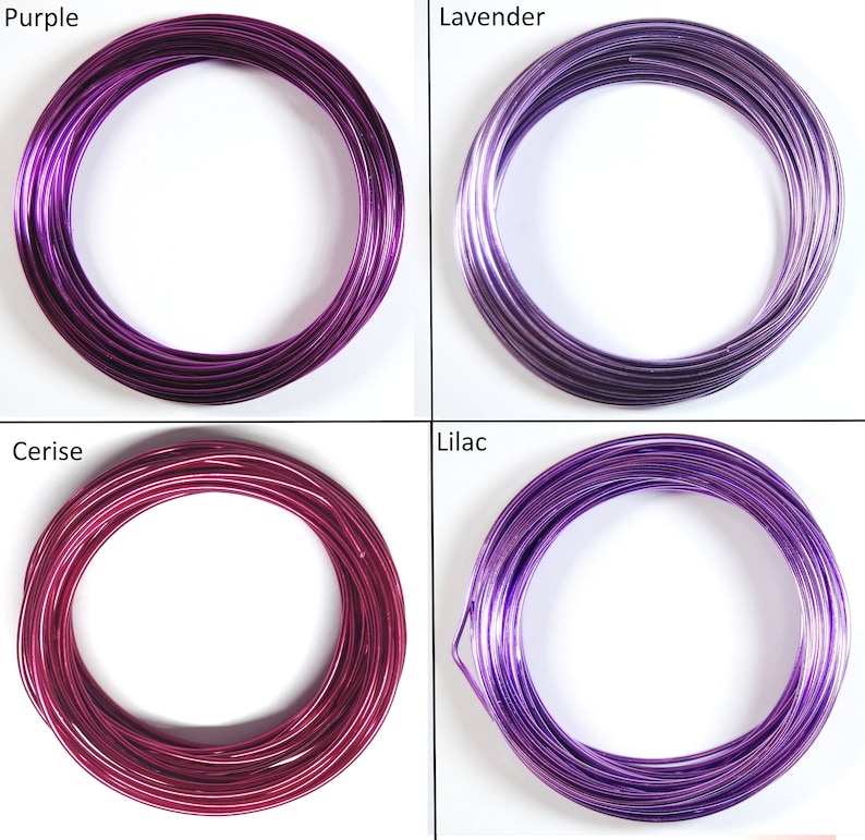 May include: Four spools of colorful wire in shades of purple, lavender, cerise, and lilac. The wire is wound into a circle and is ready for crafting projects.