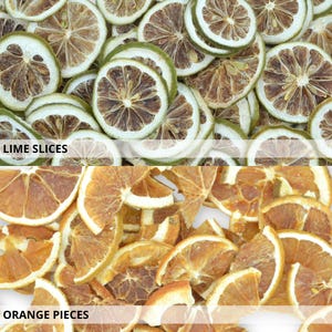 May include: Dried lime slices and orange pieces. The lime slices are green and brown, while the orange pieces are orange and brown.