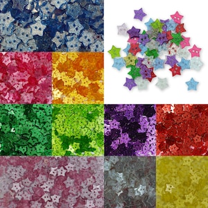 May include: Assortment of 10 colours of star-shaped glitter buttons. The colours are blue, red, orange, green, purple, pink, silver, and yellow.